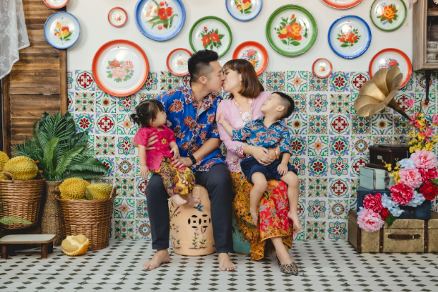 happy peranakan family with two children