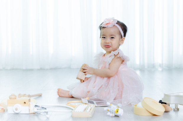 Zhua Zhou Baby in Pink Dress with Toys