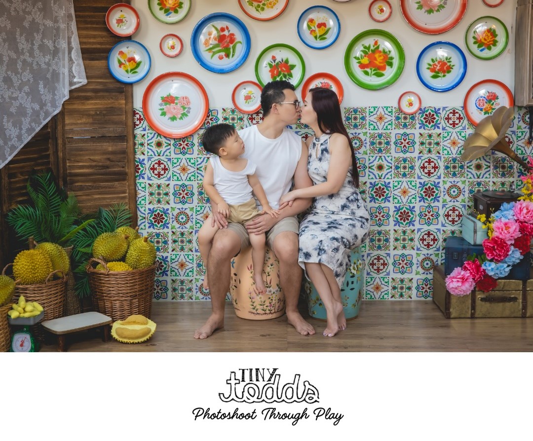 Family taking picture together for a photoshoot.